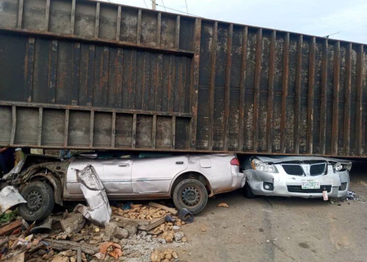 Eight school children narrowly escape death as articulated truck fell on two cars in Kogi